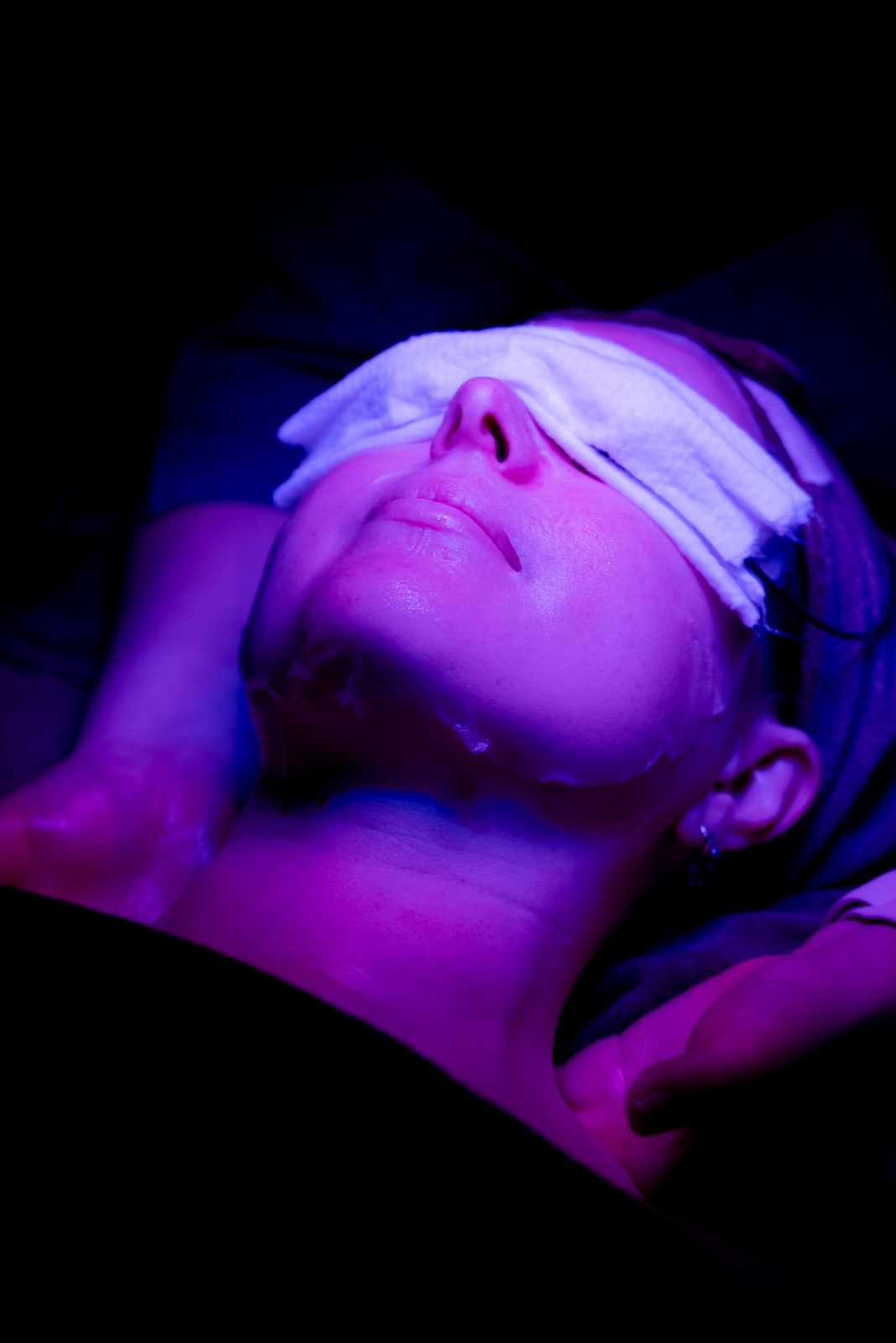 LED light therapy facial under blue dome